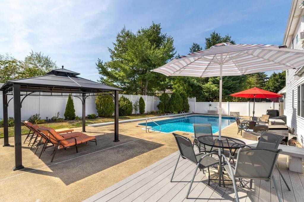 10 John Road Peabody, MA 01960 - Photo 31 of 35 an outdoor space with patio and white umbrellas