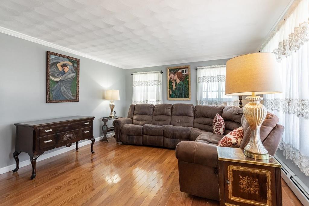 10 John Road Peabody, MA 01960 - Photo 6 of 35 a living room with furniture and a window