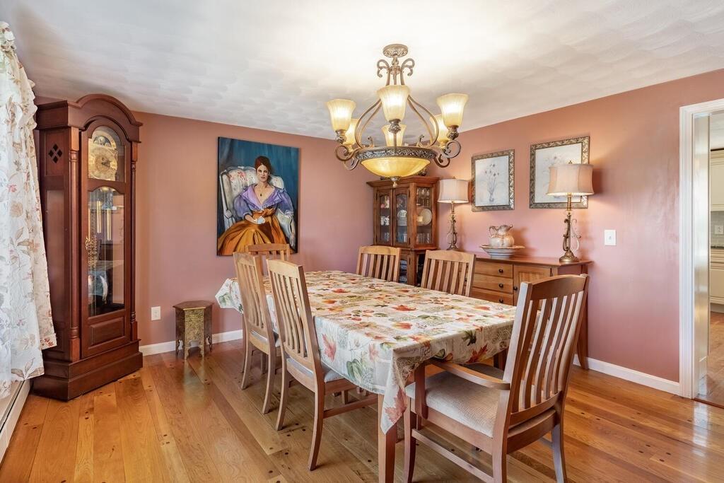 10 John Road Peabody, MA 01960 - Photo 9 of 35 a view of a dining room with furniture wooden floor and chandelier