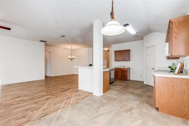 a view of a kitchen and a window