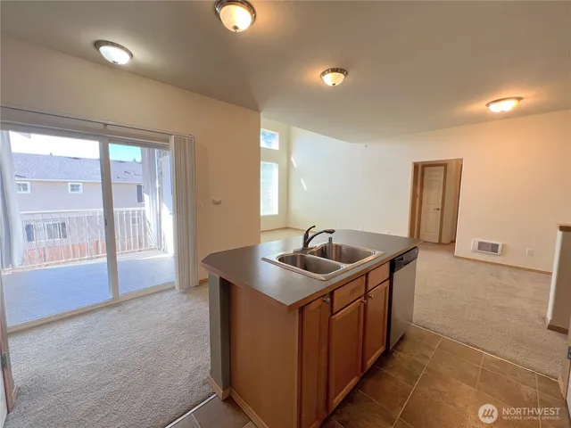 a kitchen with a sink and cabinets