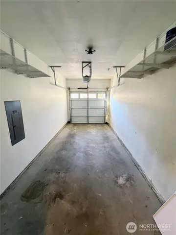 a utility room with cabinets dryer and washer