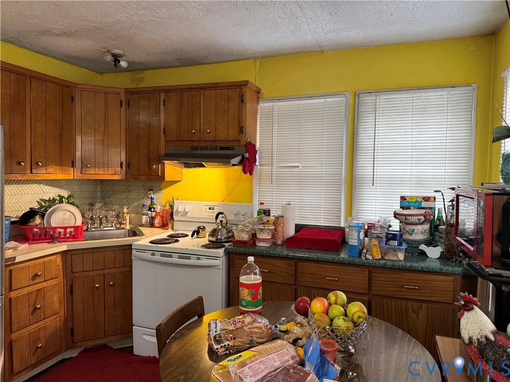 730 County Line Road Cullen, VA 23934 - Photo 7 of 9 a kitchen with a sink stove and cabinets