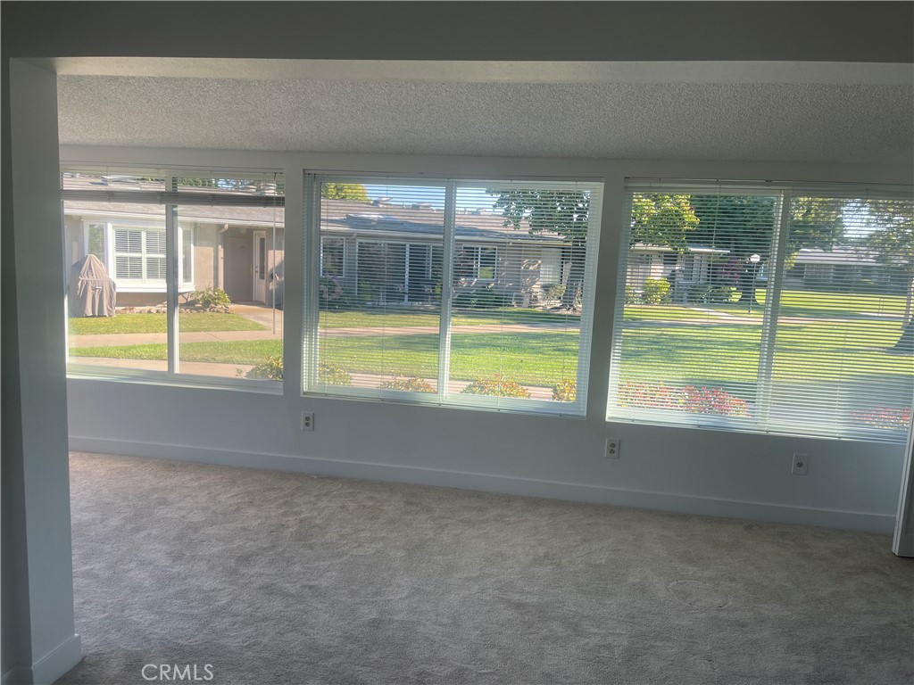 1281 Mayfield Road, Unit 6 56A Seal Beach, CA 90740 - Photo 5 of 10 a view of an empty room and window