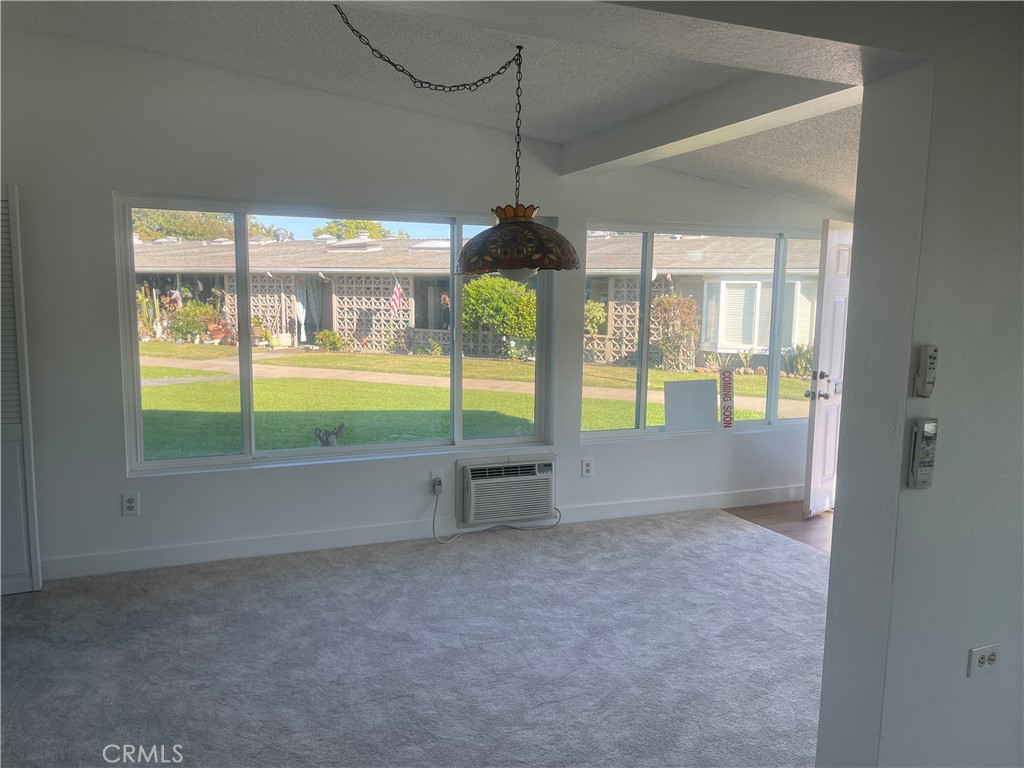 1281 Mayfield Road, Unit 6 56A Seal Beach, CA 90740 - Photo 6 of 10 a view of an empty room with window