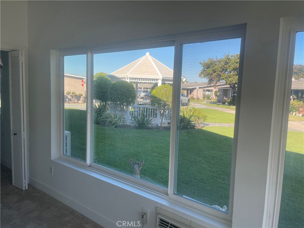 1281 Mayfield Road, Unit 6 56A Seal Beach, CA 90740 - Photo 7 of 10 a view of a glass door and a yard