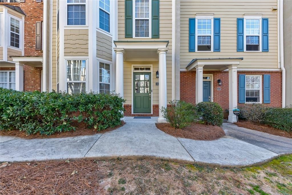 1335 Church Street, Unit C5 Decatur, GA 30030 - Photo 1 of 1 a view of a brick building next to a yard