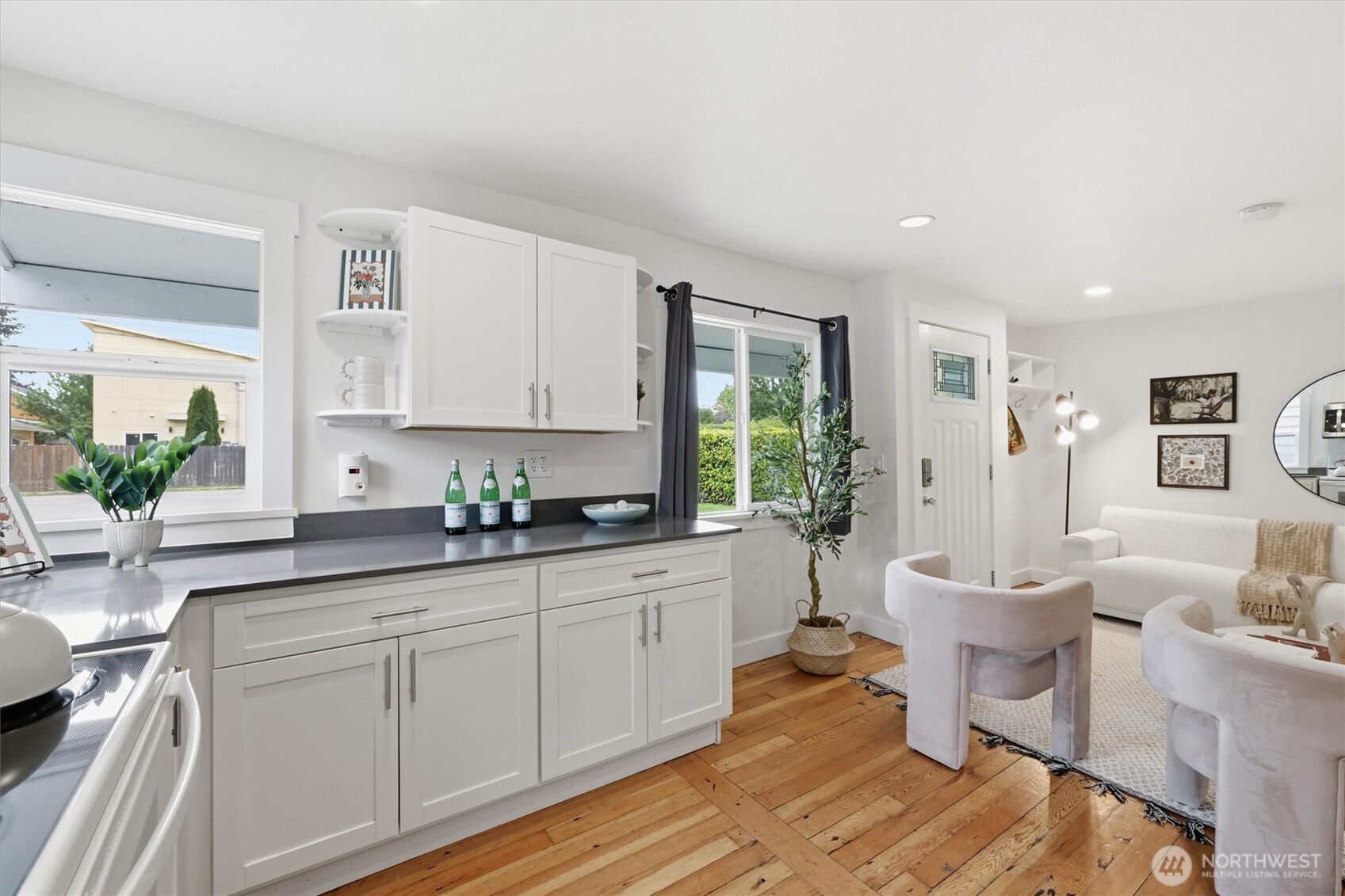 1651 Southwest 114th Street Seattle, WA 98146 - Photo 16 of 37 a large white kitchen with a sink a window and a potted plant