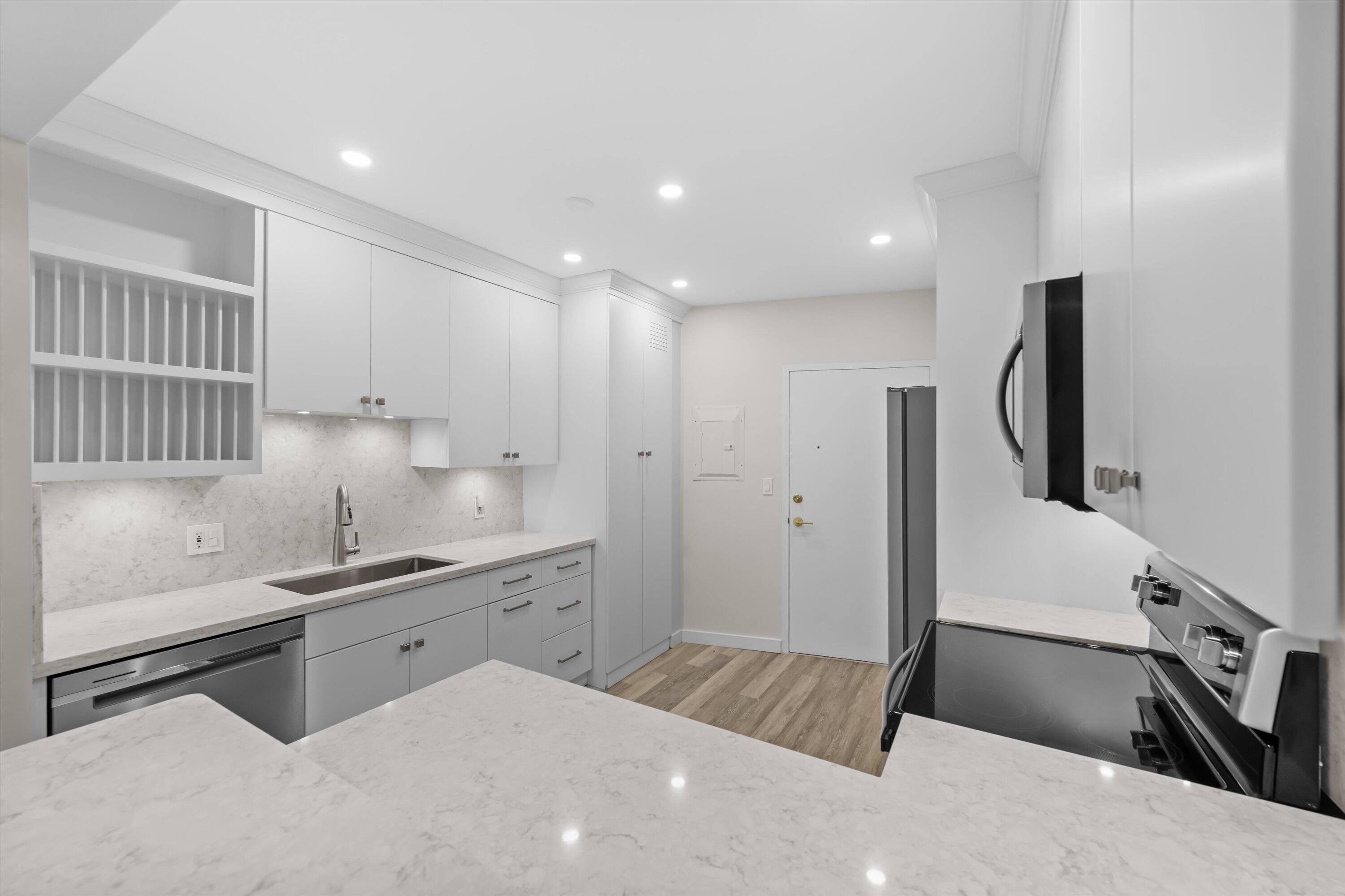 44 Cocoanut Row, Unit T27 Palm Beach, FL 33480 - Photo 10 of 40 a kitchen with a sink appliances and cabinets