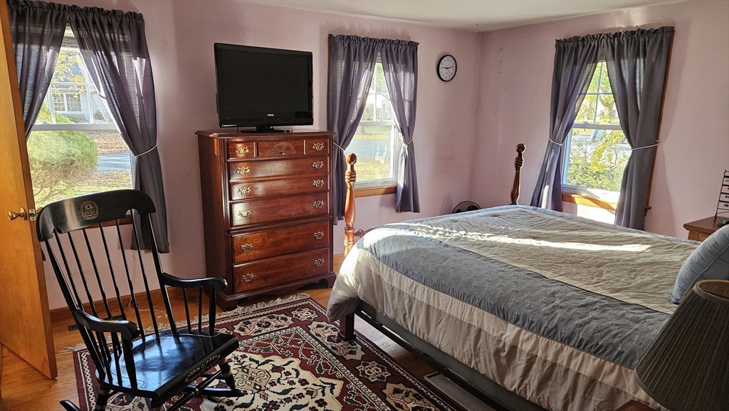 13 Capt Lathrop Drive Deerfield, MA 01373 - Photo 16 of 34 a bedroom with a bed and a flat tv screen on dresser