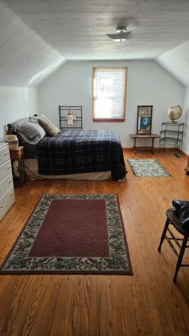 a living room with furniture rug and window