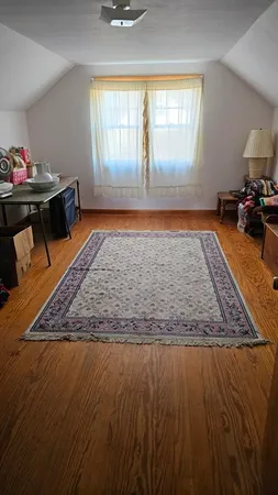 a living room with a rug