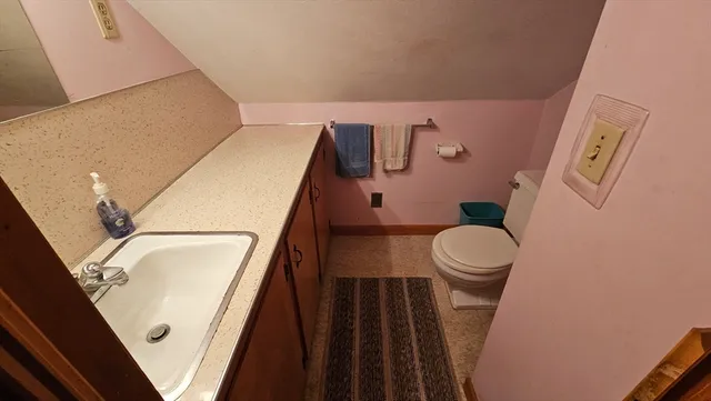 a bathroom with a toilet and a sink