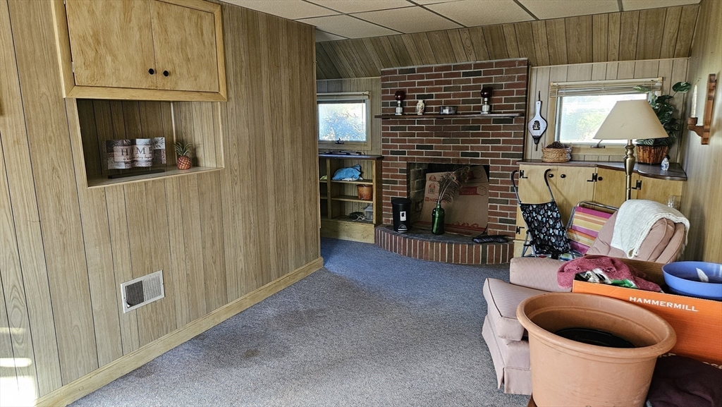 13 Capt Lathrop Drive Deerfield, MA 01373 - Photo 25 of 34 a living room with furniture and a fireplace