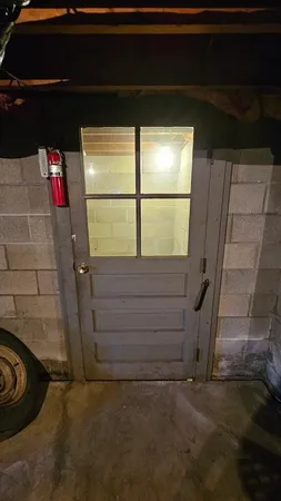 a room with a bench and a window