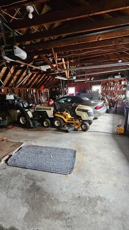a view of parking garage with cars parked
