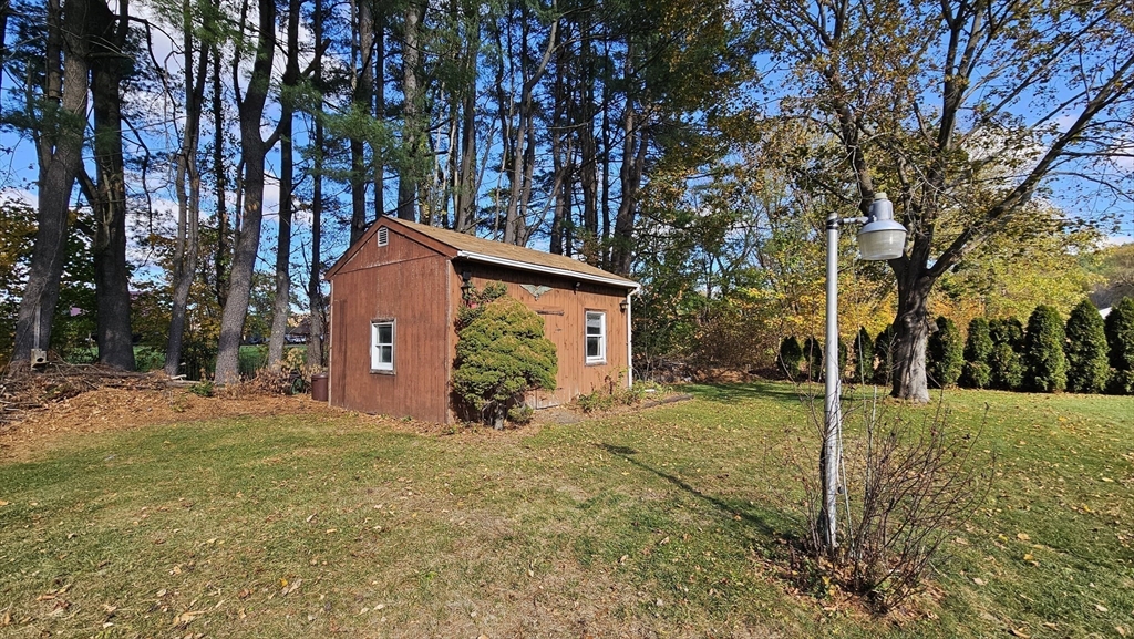 13 Capt Lathrop Drive Deerfield, MA 01373 - Photo 8 of 34 a view of a house with a yard covered in snow