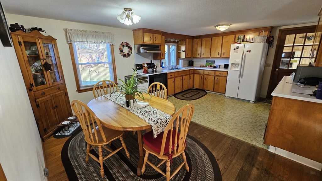 13 Capt Lathrop Drive Deerfield, MA 01373 - Photo 10 of 34 a view of a dining room with furniture and a window