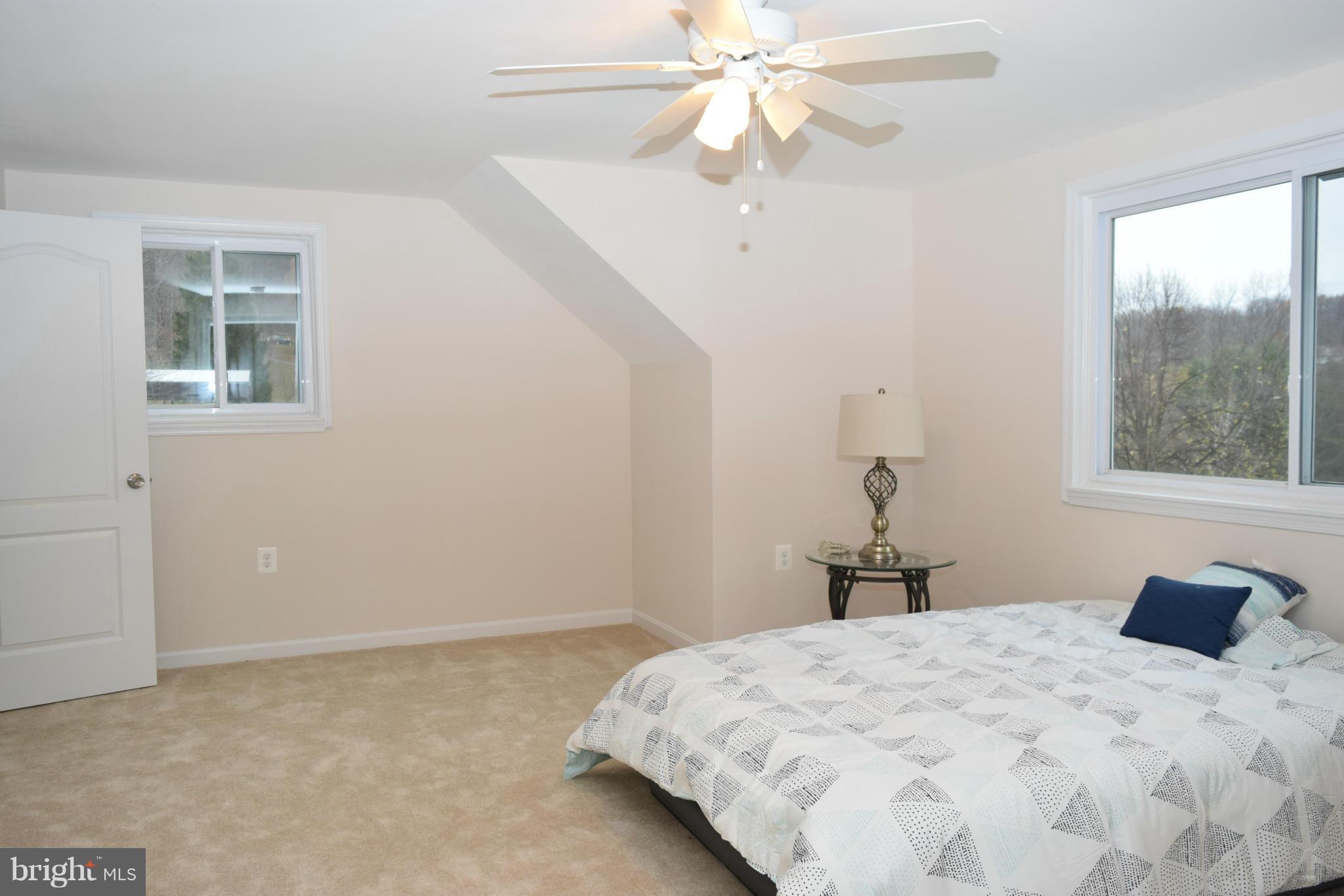 8654 Indian Springs Road Frederick, MD 21702 - Photo 14 of 30 a bedroom with a bed and a window