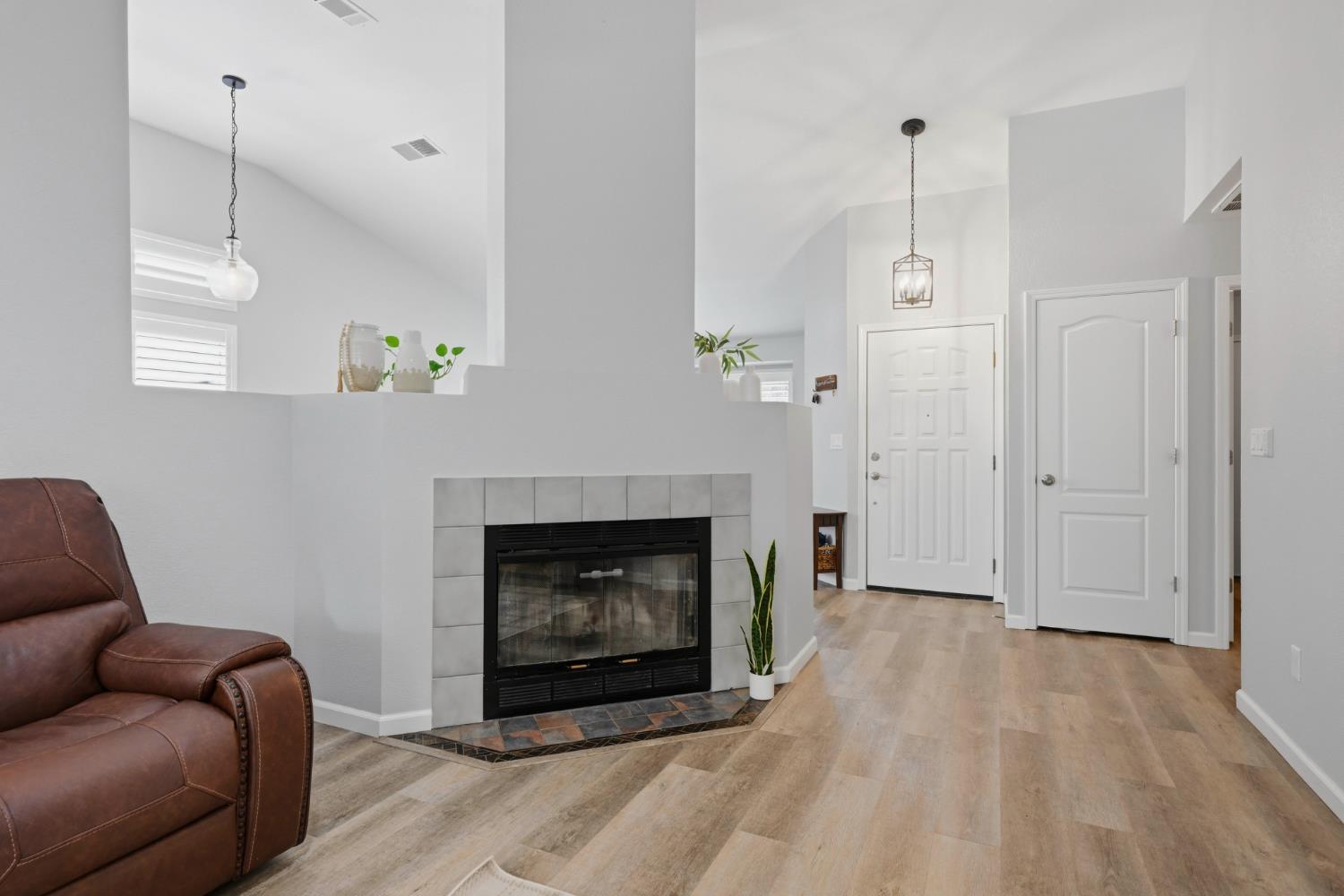 5013 Charter Road Rocklin, CA 95765 - Photo 11 of 35 a living room with furniture and a fireplace