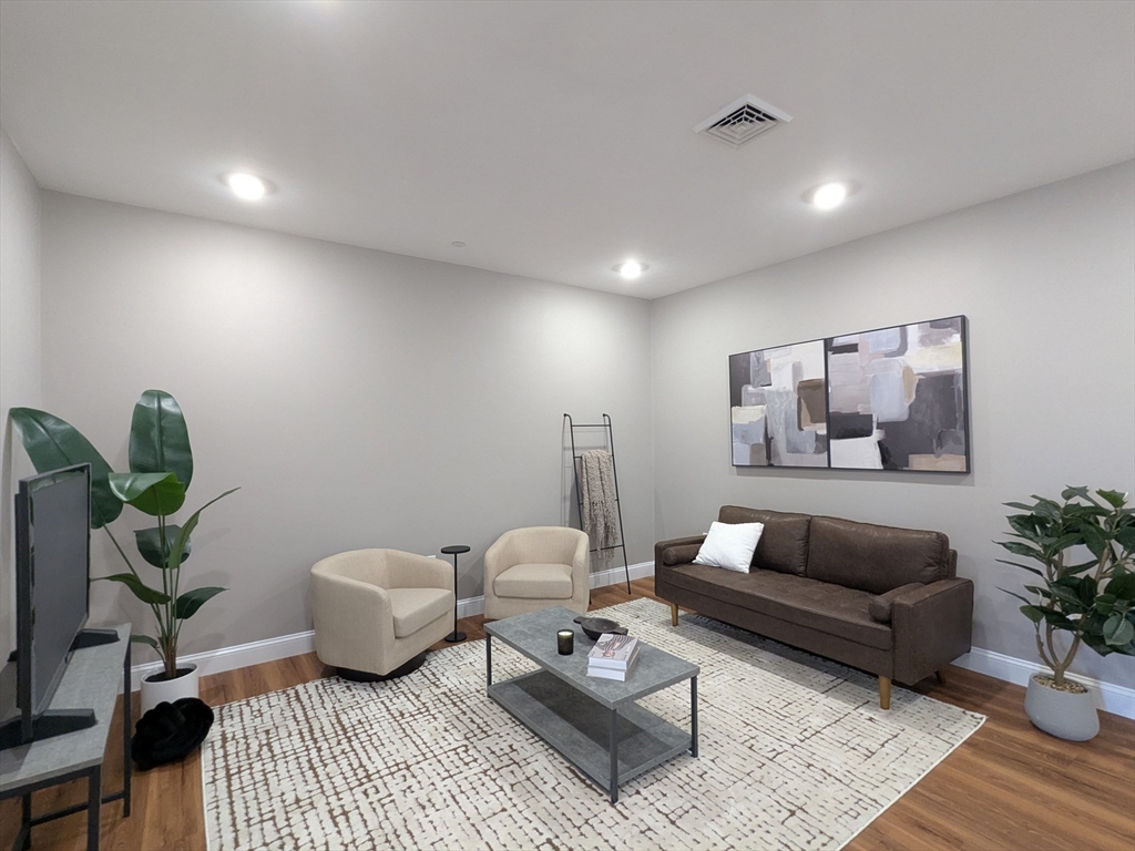 13 Nahant Street, Unit 4B Lynn, MA 01902 - Photo 12 of 28 a living room with furniture and a potted plant