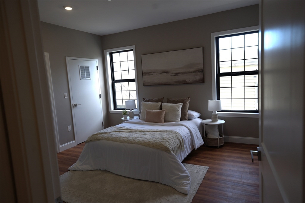 13 Nahant Street, Unit 4B Lynn, MA 01902 - Photo 17 of 28 a bedroom with a bed and a window