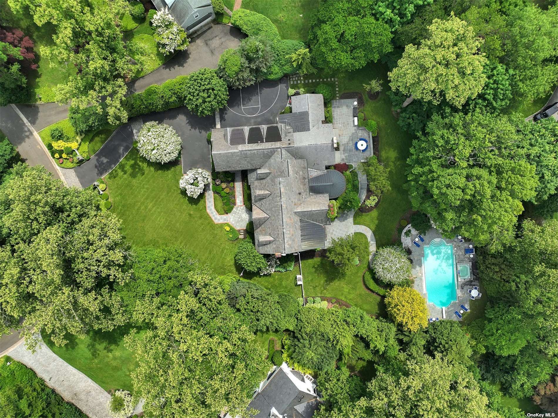 171 Elderfields Road Manhasset, NY 11030 - Photo 1 of 1 an aerial view of a house with garden space and street view