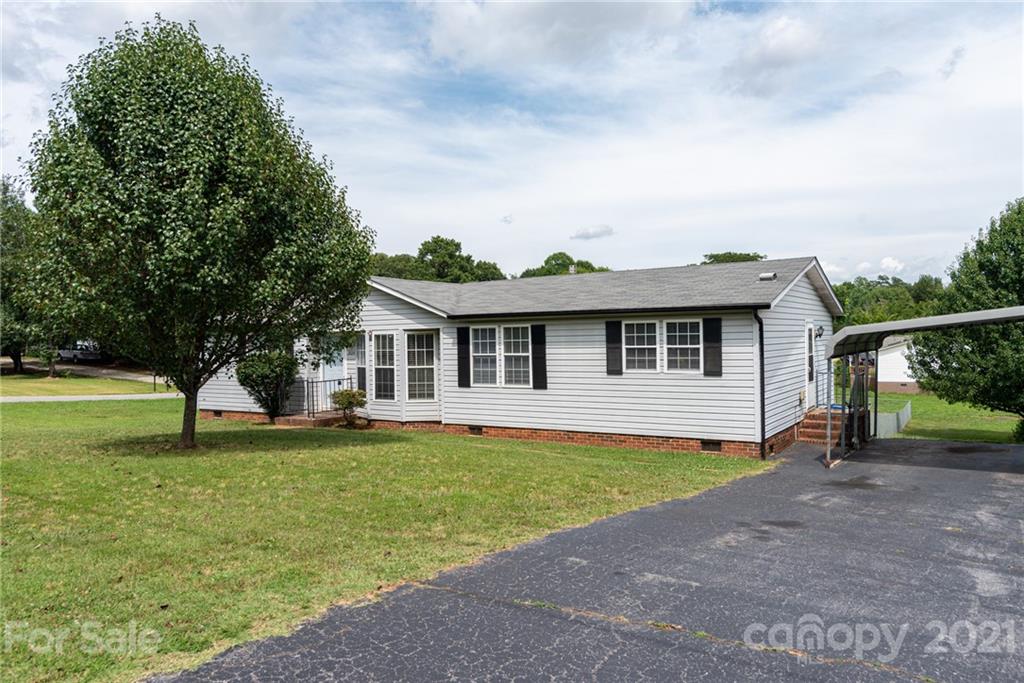 3034 St James Church Road Denver, NC 28037 - Photo 1 of 23 a view of a house with a swimming pool and a yard