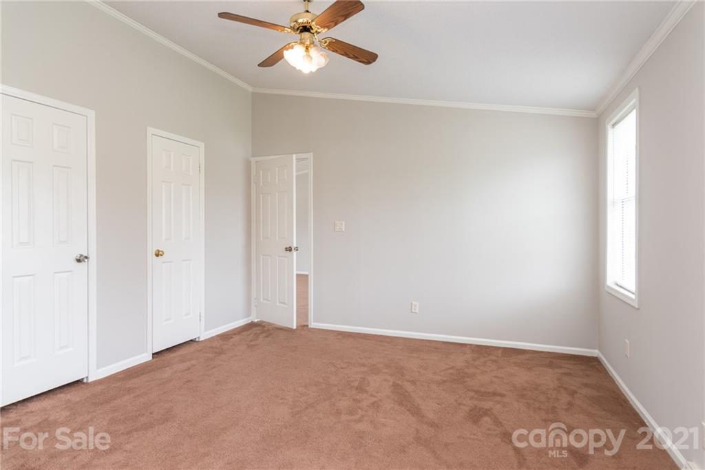 3034 St James Church Road Denver, NC 28037 - Photo 15 of 23 a view of an empty room and a ceiling fan
