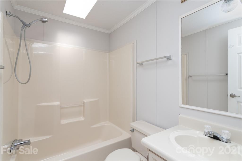 3034 St James Church Road Denver, NC 28037 - Photo 17 of 23 a bathroom with a sink and a mirror