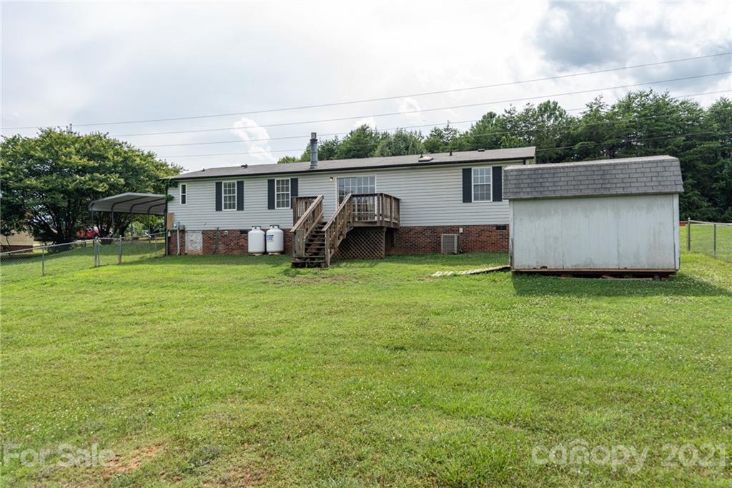 3034 St James Church Road Denver, NC 28037 - Photo 22 of 23 a view of a house with a yard and sitting area