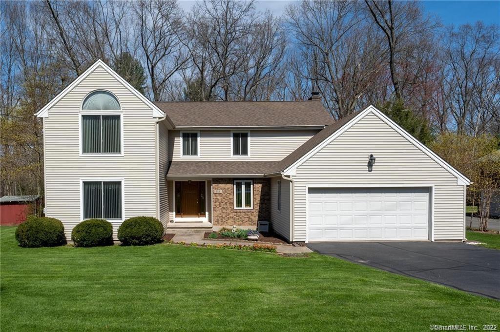 315 Spring Lake Road Southington, CT 06489 - Photo 1 of 1 a front view of a house with a yard and garage