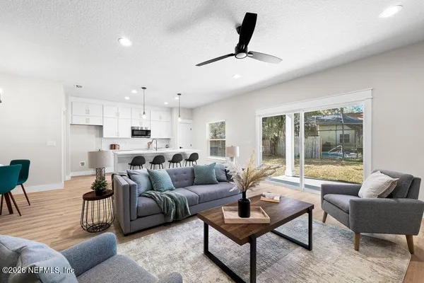a living room with furniture and a large window