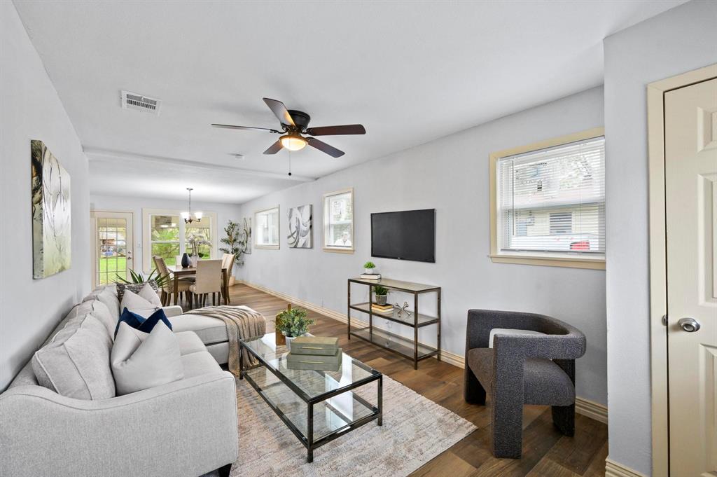 409 East 2nd Street Quinlan, TX 75474 - Photo 3 of 26 a living room with furniture and a flat screen tv