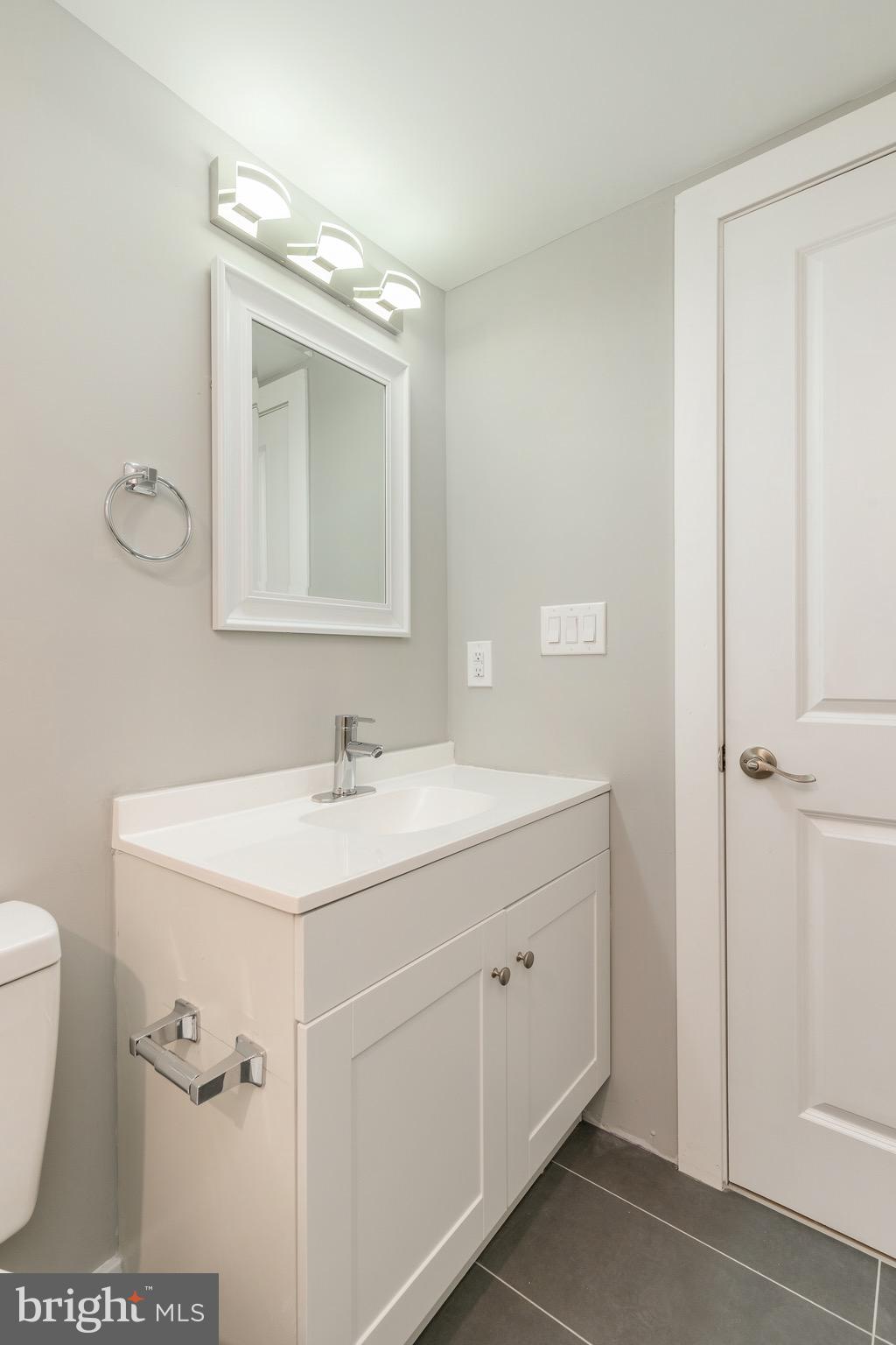 2500 North Mascher Street, Unit 9 Philadelphia, PA 19133 - Photo 11 of 17 a bathroom with a sink a toilet and mirror