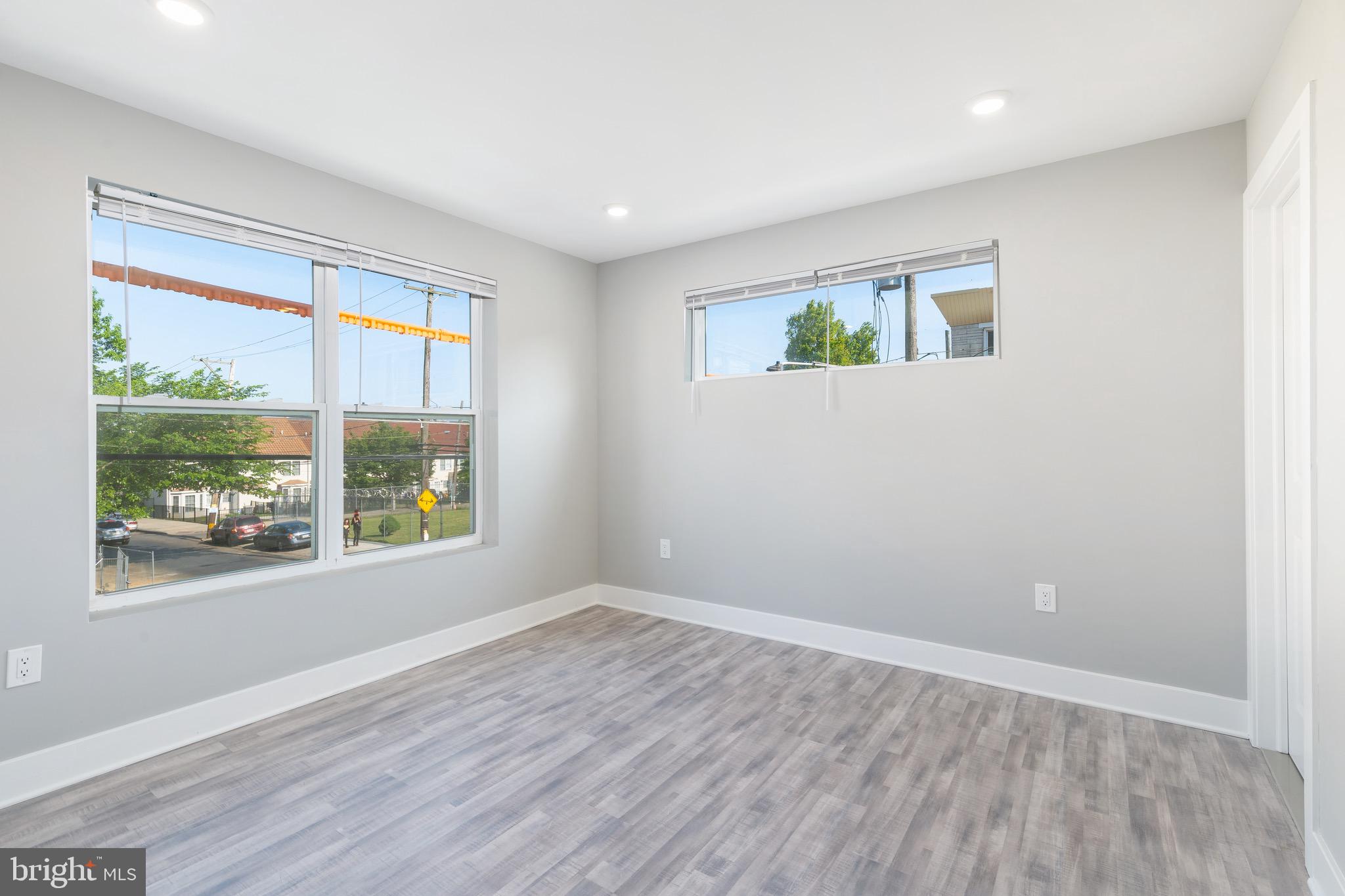 2500 North Mascher Street, Unit 9 Philadelphia, PA 19133 - Photo 12 of 17 a view of an empty room with wooden floor and a window