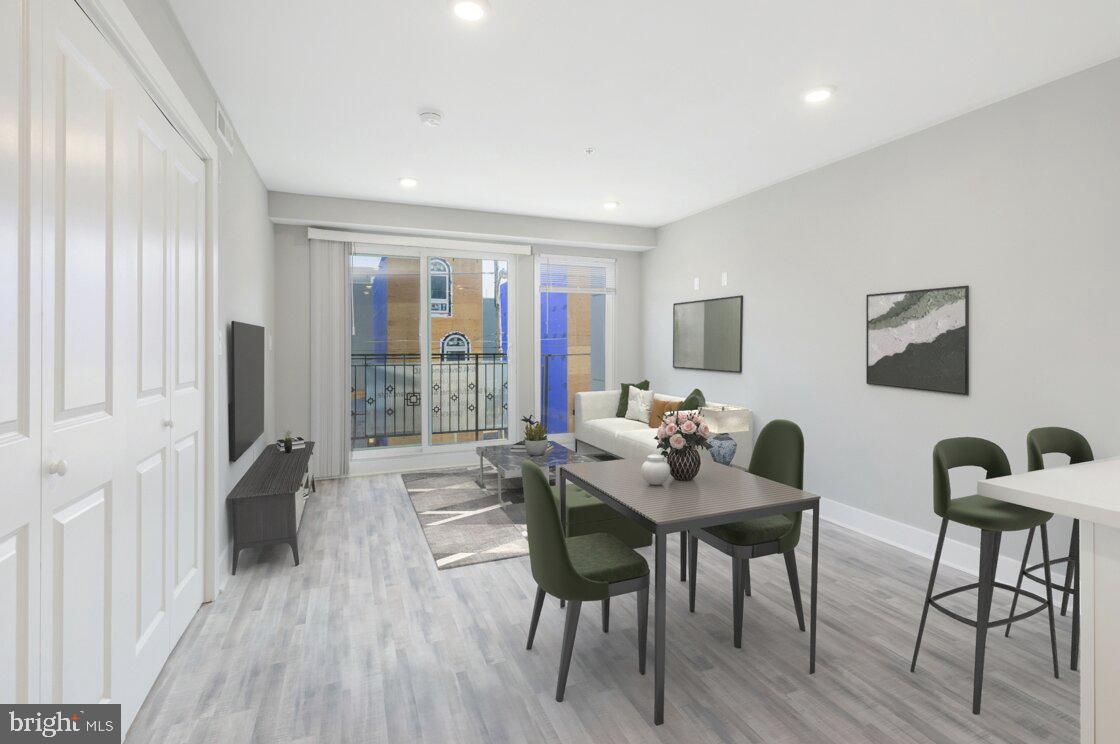 2500 North Mascher Street, Unit 9 Philadelphia, PA 19133 - Photo 6 of 17 a living room with furniture and a flat screen tv