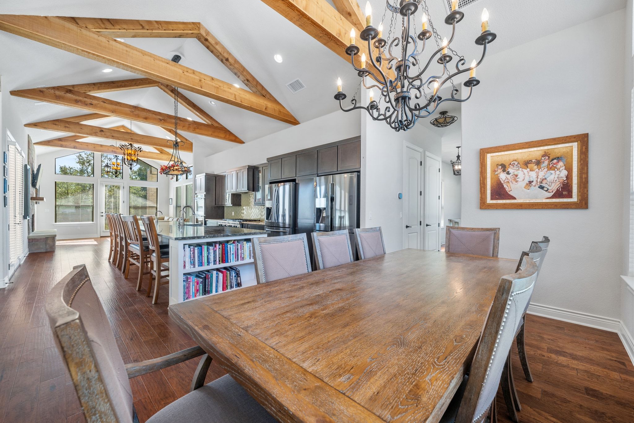20607 Thurman Bend Road Spicewood, TX 78669 - Photo 12 of 39 a dining room with furniture and wooden floor