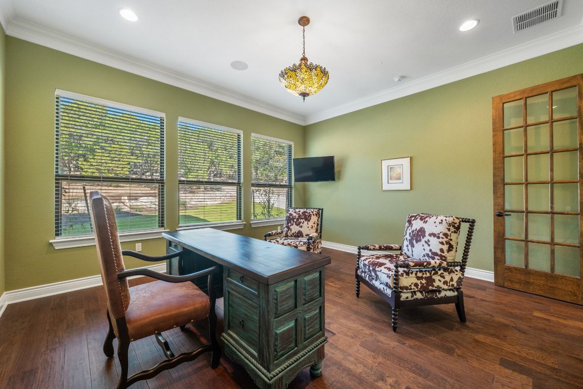 20607 Thurman Bend Road Spicewood, TX 78669 - Photo 19 of 40 Office space with ornamental molding and dark wood-style flooring