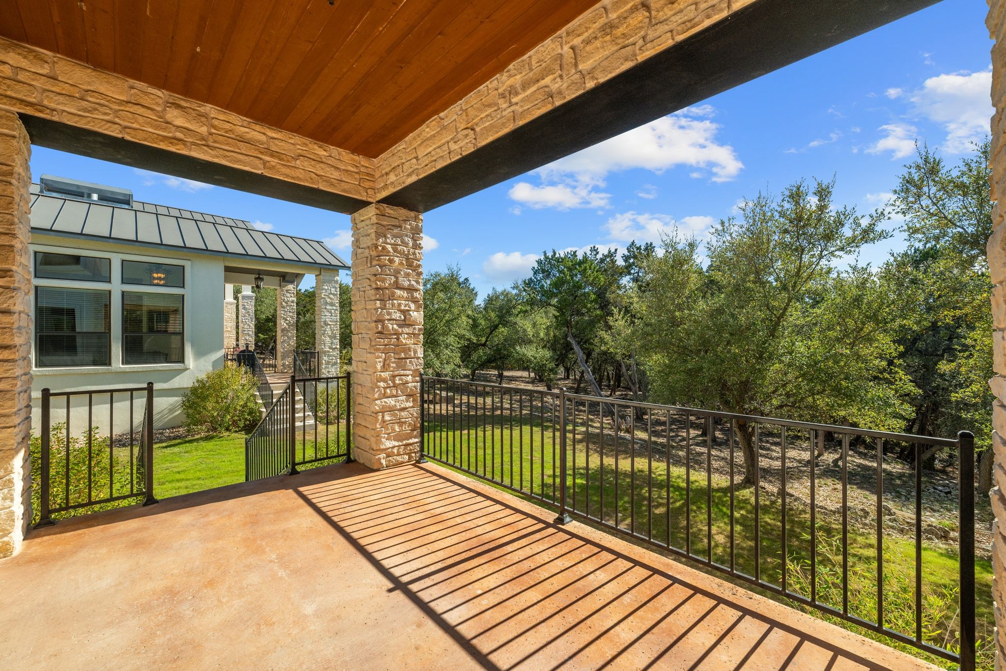 20607 Thurman Bend Road Spicewood, TX 78669 - Photo 31 of 39 a view of a balcony with wooden floor
