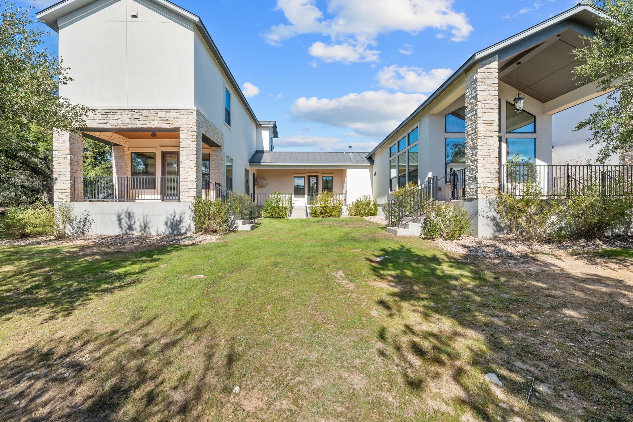 20607 Thurman Bend Road Spicewood, TX 78669 - Photo 37 of 39 a front view of a house with a yard
