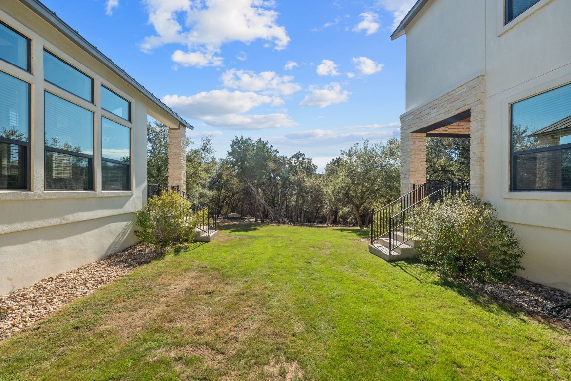 20607 Thurman Bend Road Spicewood, TX 78669 - Photo 38 of 40 View of green lawn with stairs