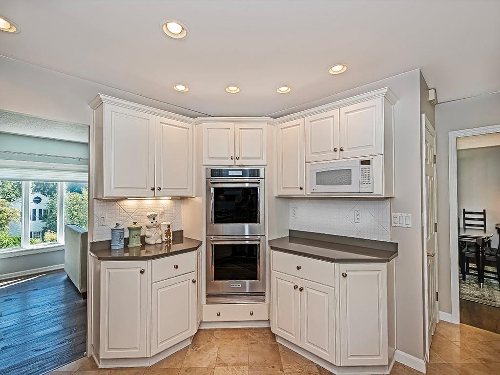 9745 Lindsay Road Pittsburgh, PA 15237 - Photo 12 of 36 a kitchen with white cabinets and appliances