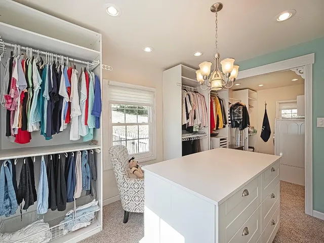 a view of a kitchen area with furniture and chandelier