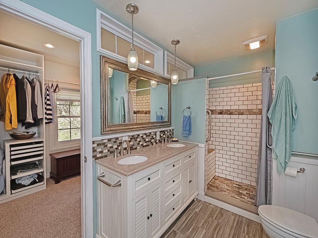 9745 Lindsay Road Pittsburgh, PA 15237 - Photo 23 of 36 a bathroom with a sink a toilet and shower