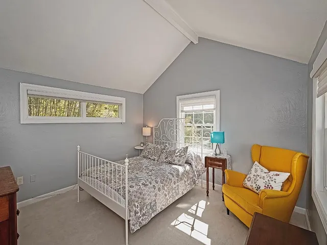 a bed room with a bed and a couch