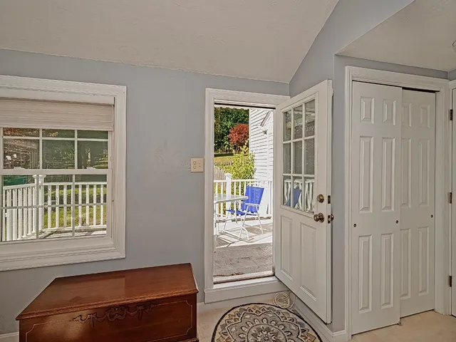 a view of a hallway with windows