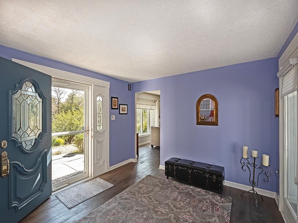 9745 Lindsay Road Pittsburgh, PA 15237 - Photo 3 of 36 a bedroom with a bed and wooden floor