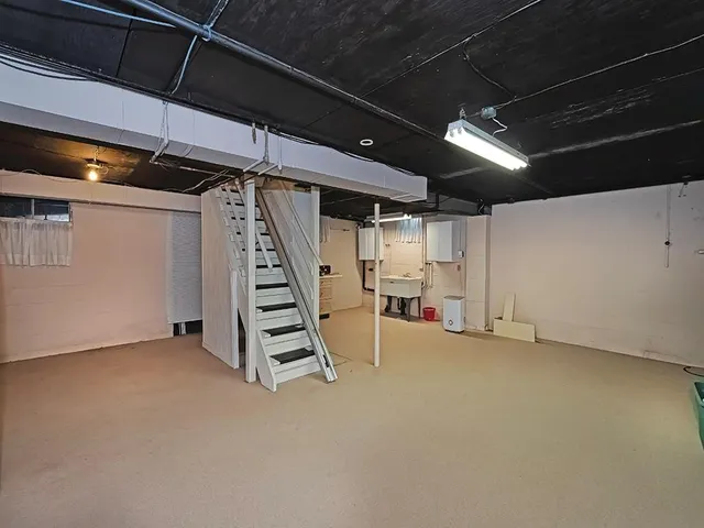 a view of an empty room with stairs