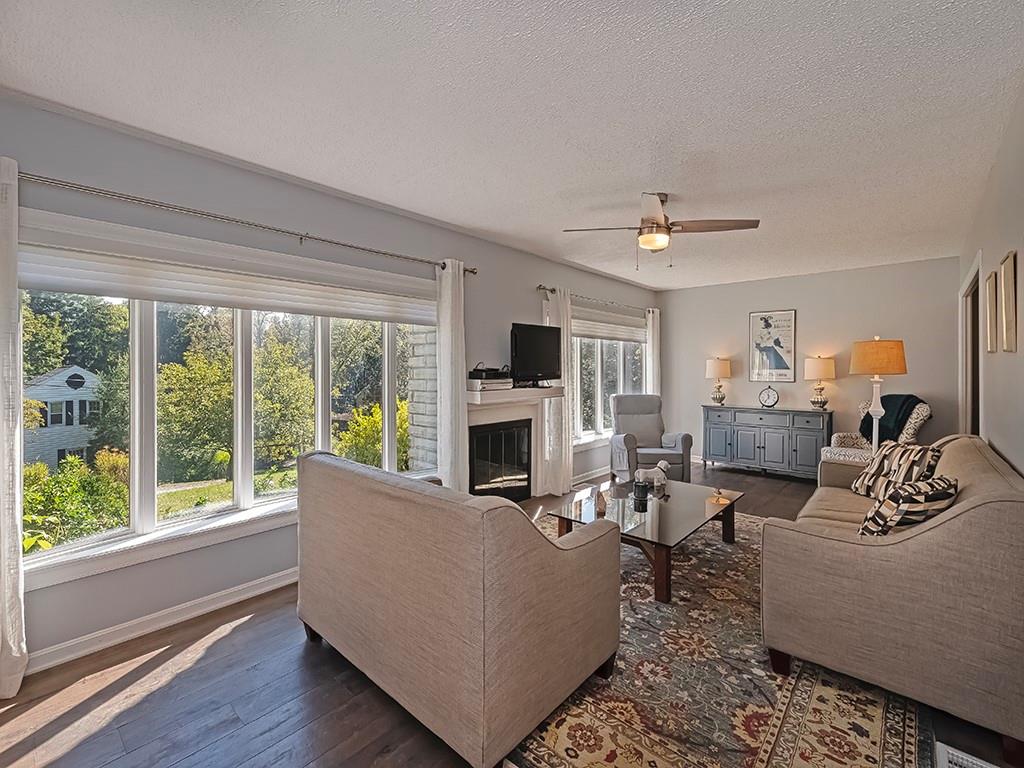 9745 Lindsay Road Pittsburgh, PA 15237 - Photo 5 of 36 a living room with furniture fireplace and flat screen tv